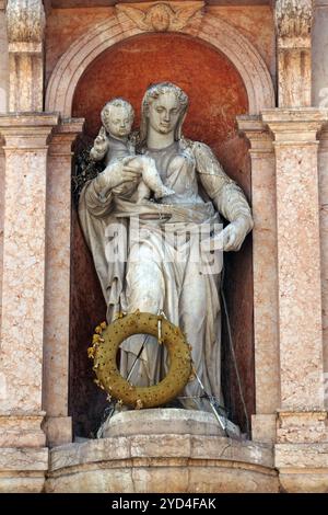 Virgin Mary with baby Jesus, statue on Piazza delle Erbe Market`s square in Verona, Italy Stock Photo